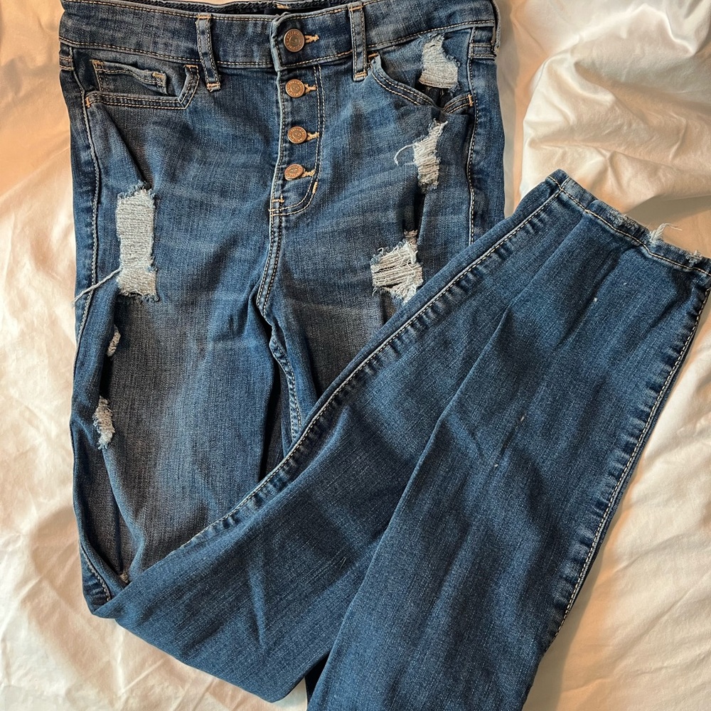 Hollister high-rise super skinny distress stone wash jean.